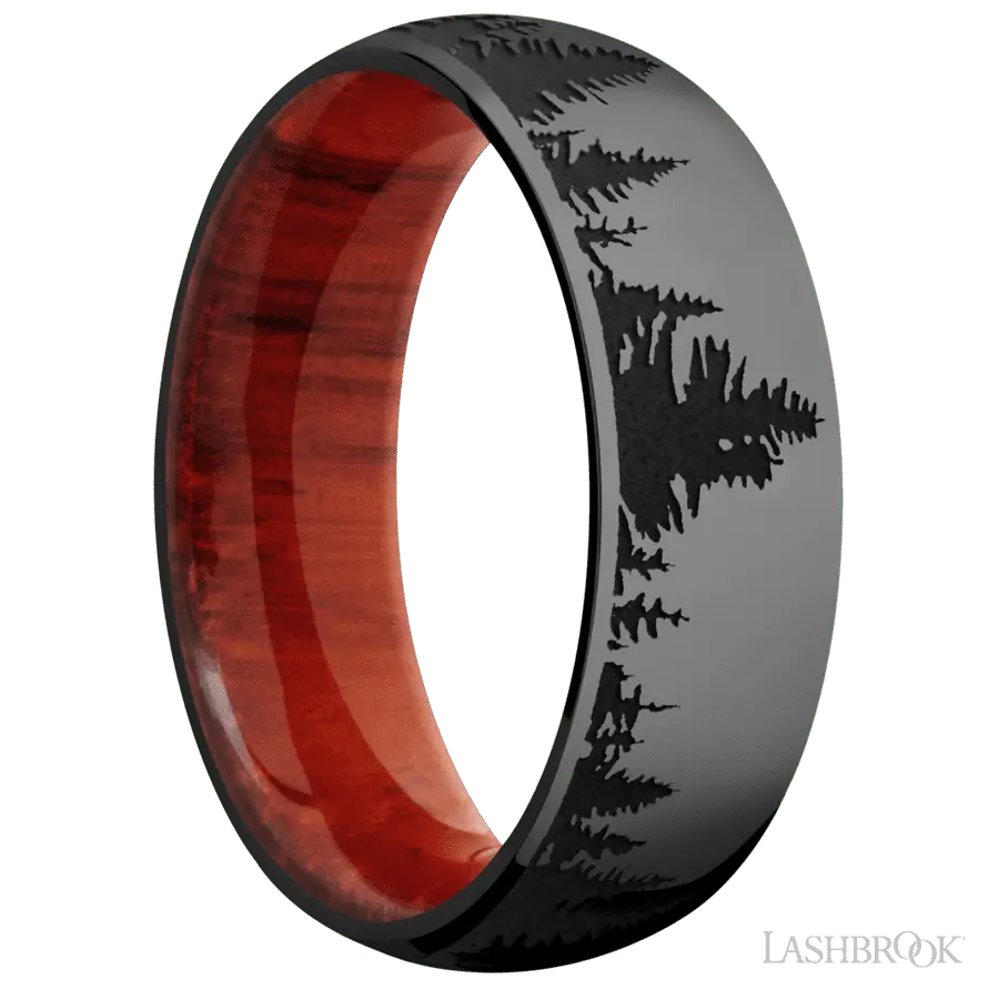 7 mm wide/Domed/Zirconium band with a laser carved Trees pattern also featuring a Padauk sleeve.