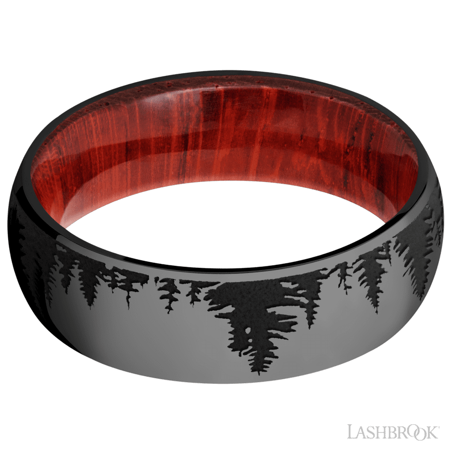 7 mm wide/Domed/Zirconium band with a laser carved Trees pattern also featuring a Padauk sleeve.
