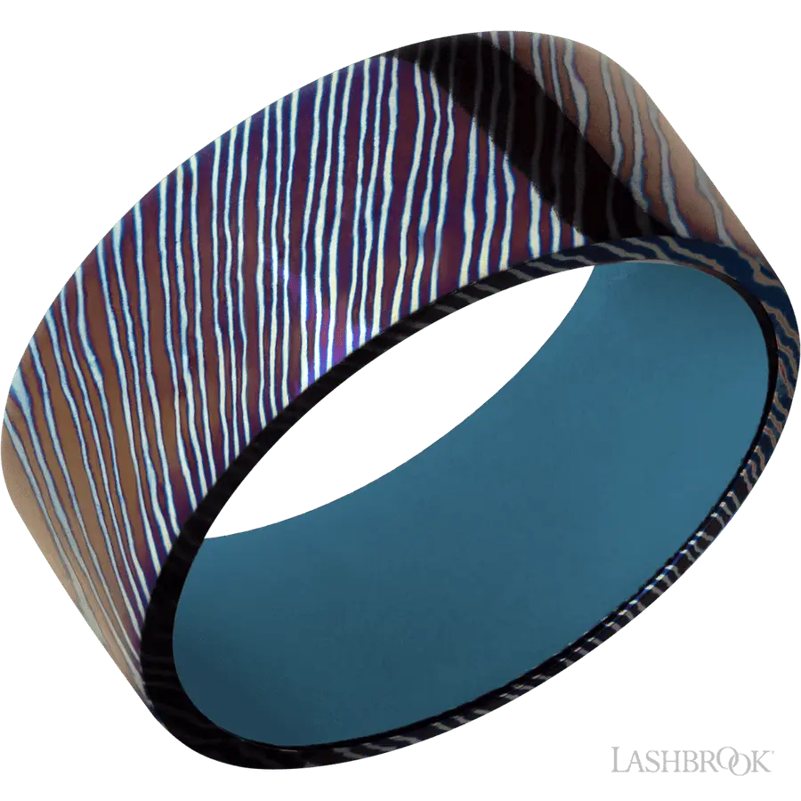 9 mm wide Flat Titanium Damascus band featuring a Royal Blue sleeve. by Lashbrook | The Diamond Store Las Vegas